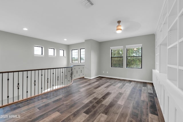 18544 E Caledonia Dr, Queen Creek, AZ 85142 - unfurnished room with a ceiling fan, wood finished floors, visible vents, baseboards, and recessed lighting