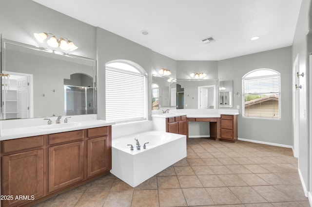 18544 E Caledonia Dr, Queen Creek, AZ 85142 - bathroom featuring visible vents, a shower stall, a garden tub, and a sink