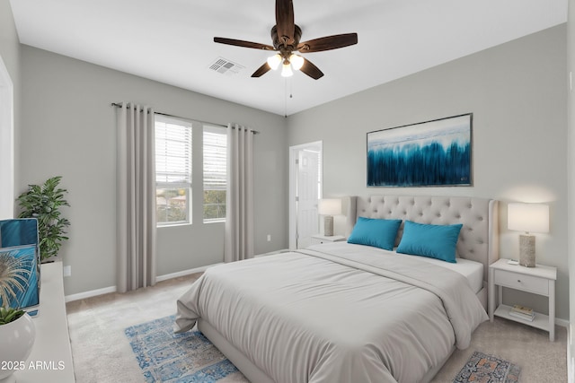 18544 E Caledonia Dr, Queen Creek, AZ 85142 - bedroom with ceiling fan, baseboards, visible vents, and light carpet
