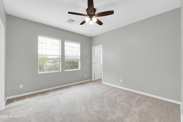 18544 E Caledonia Dr, Queen Creek, AZ 85142 - carpeted spare room featuring visible vents, baseboards, and ceiling fan