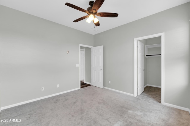18544 E Caledonia Dr, Queen Creek, AZ 85142 - unfurnished bedroom with a ceiling fan, carpet, baseboards, a spacious closet, and a closet