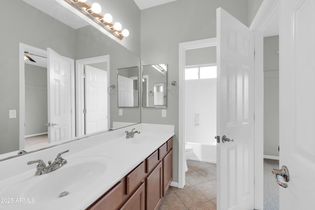 18544 E Caledonia Dr, Queen Creek, AZ 85142 - bathroom with tile patterned flooring, a bathing tub, double vanity, and a sink