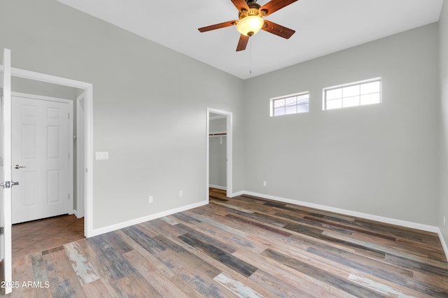 18544 E Caledonia Dr, Queen Creek, AZ 85142 - spare room with baseboards, wood finished floors, and ceiling fan