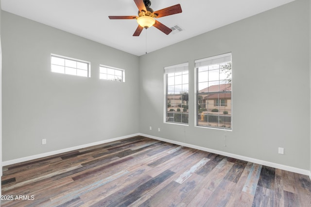 18544 E Caledonia Dr, Queen Creek, AZ 85142 - empty room with visible vents, baseboards, ceiling fan, and dark wood-style flooring