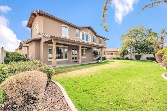 18544 E Caledonia Dr, Queen Creek, AZ 85142 - rear view of property featuring stucco siding, a ceiling fan, a tile roof, a fenced backyard, and a patio area