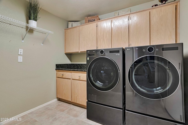 2984 N 152nd Dr, Goodyear, AZ 85395 - laundry room with cabinet space, washing machine and dryer, and light tile patterned floors