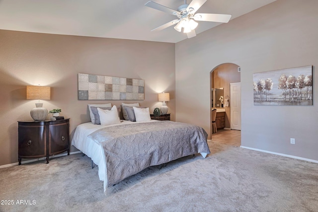 2984 N 152nd Dr, Goodyear, AZ 85395 - bedroom with arched walkways, light colored carpet, and ceiling fan