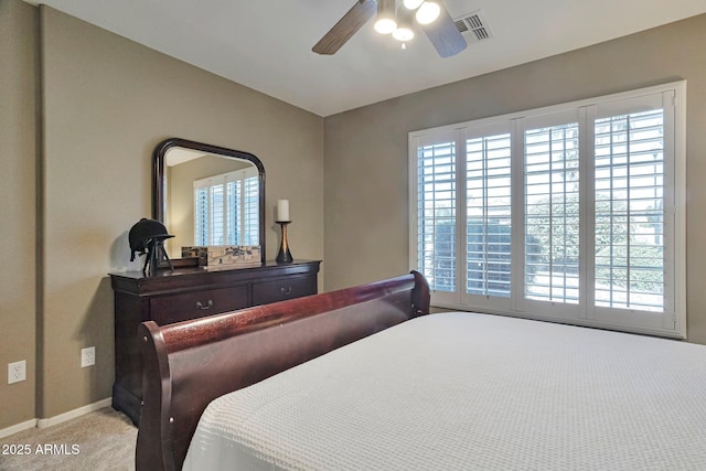 2984 N 152nd Dr, Goodyear, AZ 85395 - carpeted bedroom featuring multiple windows and a ceiling fan