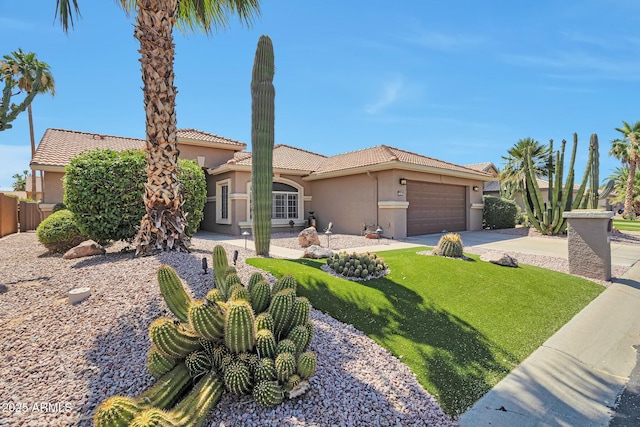 2984 N 152nd Dr, Goodyear, AZ 85395 - mediterranean / spanish-style house with stucco siding, an attached garage, a tiled roof, and driveway