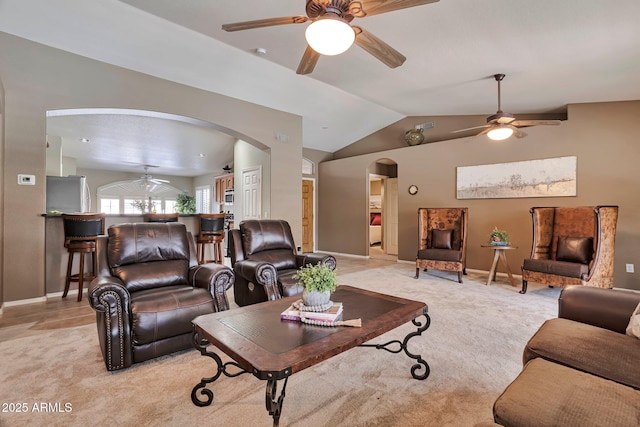 2984 N 152nd Dr, Goodyear, AZ 85395 - living area featuring a ceiling fan, arched walkways, vaulted ceiling, and light carpet