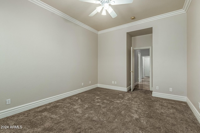 carpeted empty room featuring ceiling fan and ornamental molding