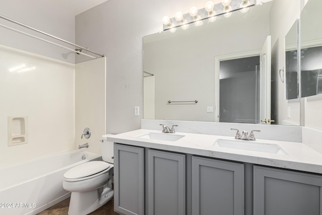 full bathroom featuring toilet,  shower combination, and vanity