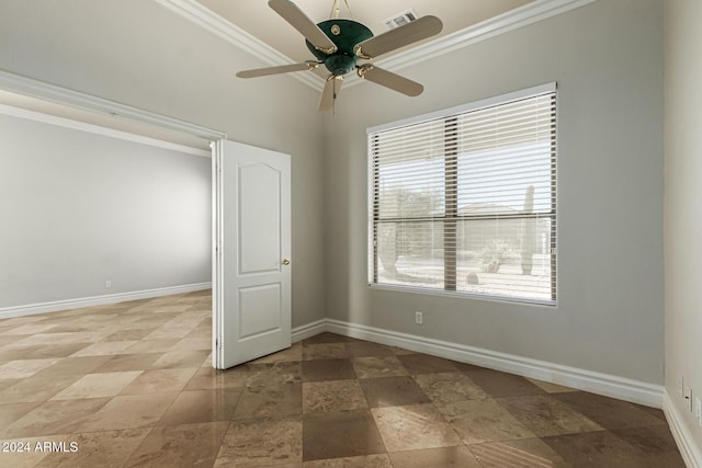 empty room with ceiling fan and ornamental molding