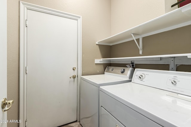 clothes washing area featuring washing machine and dryer