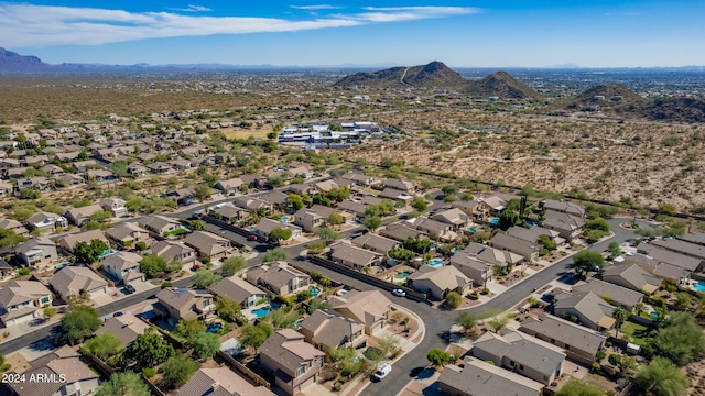 birds eye view of property with a mountain view