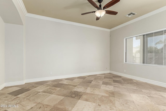 spare room with ceiling fan and ornamental molding