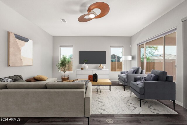 living area featuring visible vents, ceiling fan, and wood finished floors