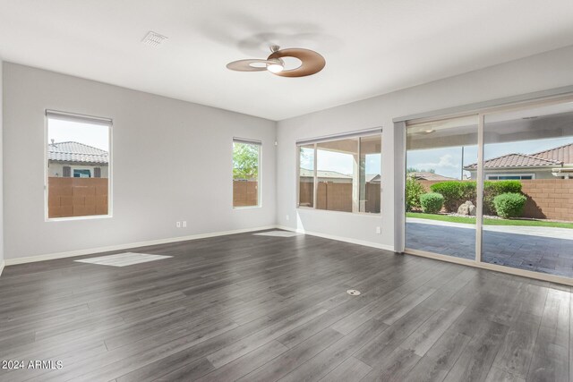 unfurnished living room featuring hardwood / wood-style flooring