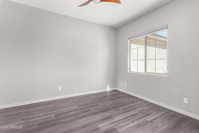 empty room featuring ceiling fan and carpet floors