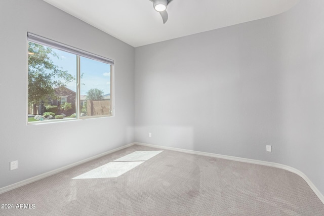 unfurnished room featuring carpet flooring and baseboards