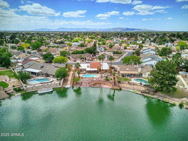birds eye view of property with a residential view and a water and mountain view