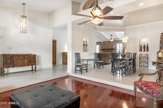 living room with ceiling fan, wood finished floors, baseboards, lofted ceiling with beams, and recessed lighting