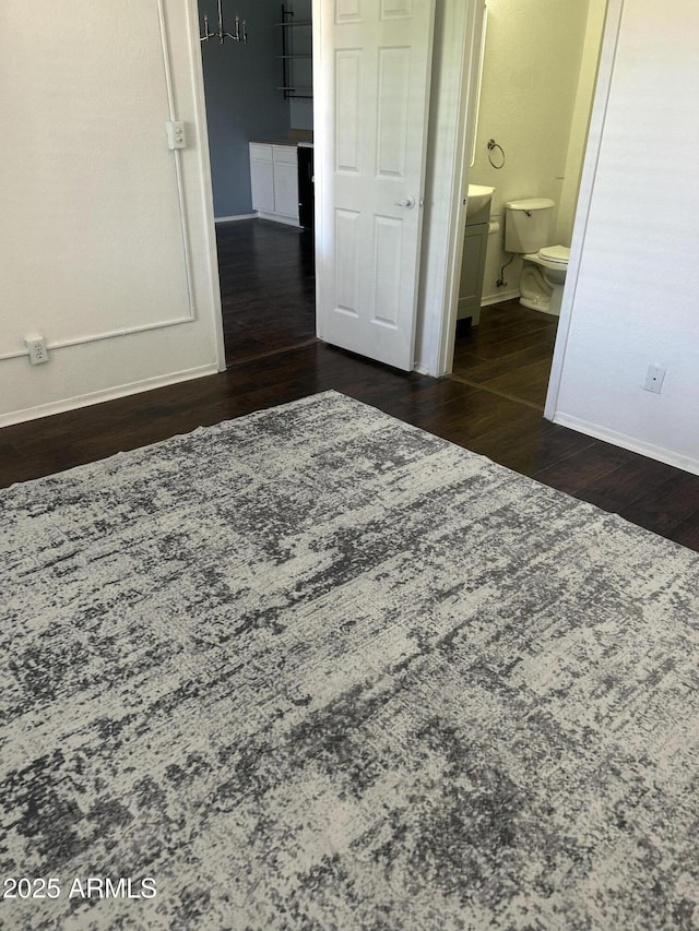 1440 N Idaho Rd Unit 2041, Apache Junction, AZ 85119 - bedroom featuring wood finished floors and connected bathroom