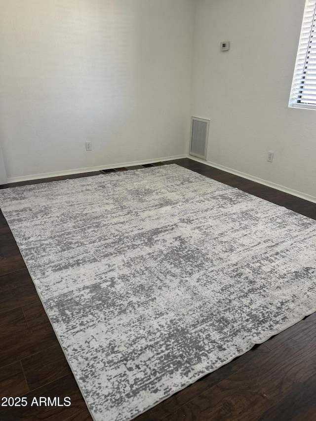 1440 N Idaho Rd Unit 2041, Apache Junction, AZ 85119 - spare room with dark wood finished floors and baseboards