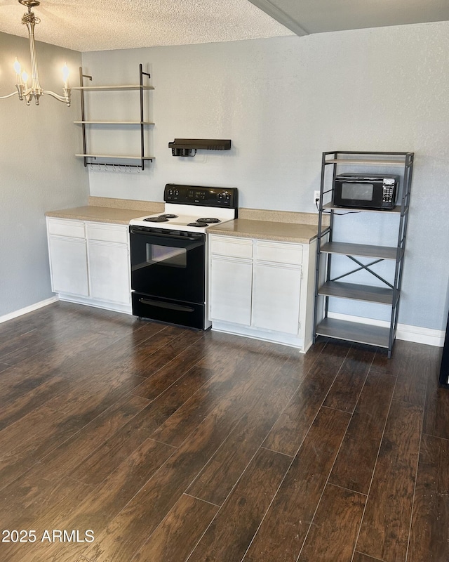 1440 N Idaho Rd Unit 2041, Apache Junction, AZ 85119 - kitchen with range with electric stovetop, a chandelier, light countertops, dark wood-style flooring, and a textured ceiling