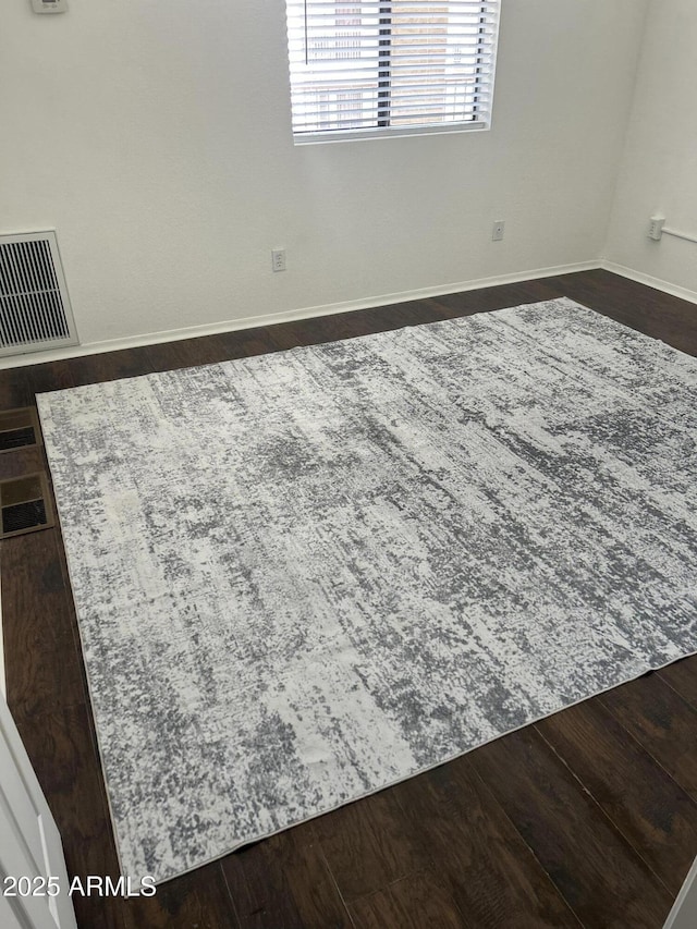 1440 N Idaho Rd Unit 2041, Apache Junction, AZ 85119 - empty room featuring dark wood finished floors and baseboards