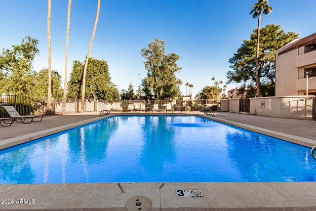 view of swimming pool featuring a patio area