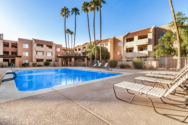 view of swimming pool with a patio area
