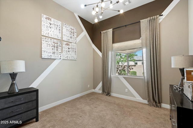 bedroom with a chandelier, light carpet, and baseboards