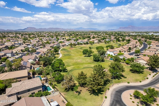 birds eye view of property with a mountain view, a residential view, and view of golf course