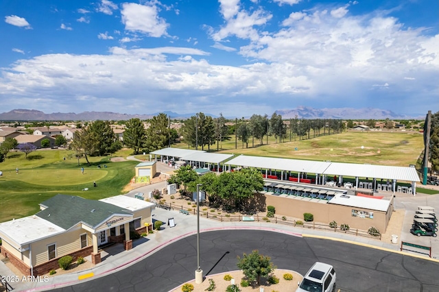 aerial view featuring golf course view and a mountain view