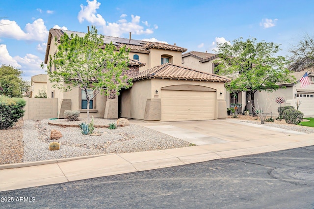 mediterranean / spanish house with stucco siding, an attached garage, driveway, and a tile roof