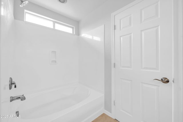 bathroom with shower / washtub combination and tile patterned flooring