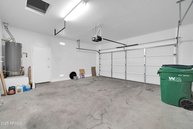 garage with gas water heater and a garage door opener