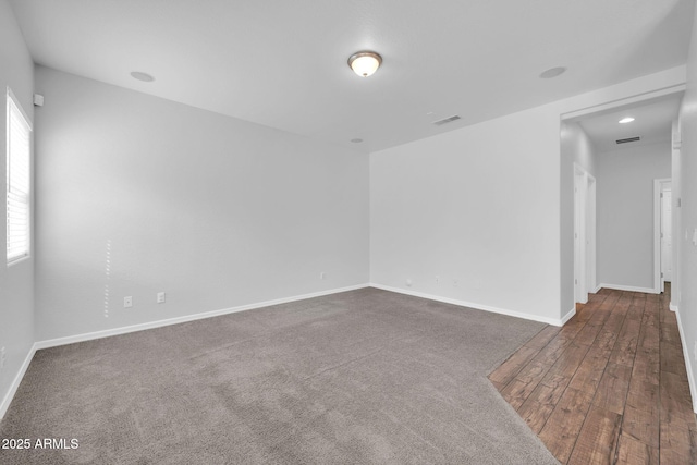 spare room with visible vents and baseboards