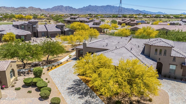 drone / aerial view featuring a residential view and a mountain view