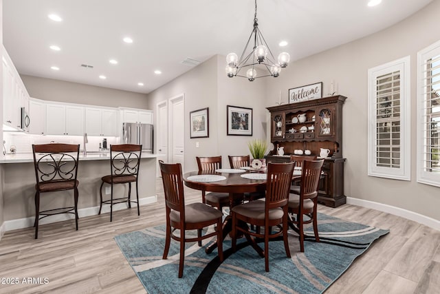 dining space featuring a chandelier, visible vents, recessed lighting, and light wood-type flooring