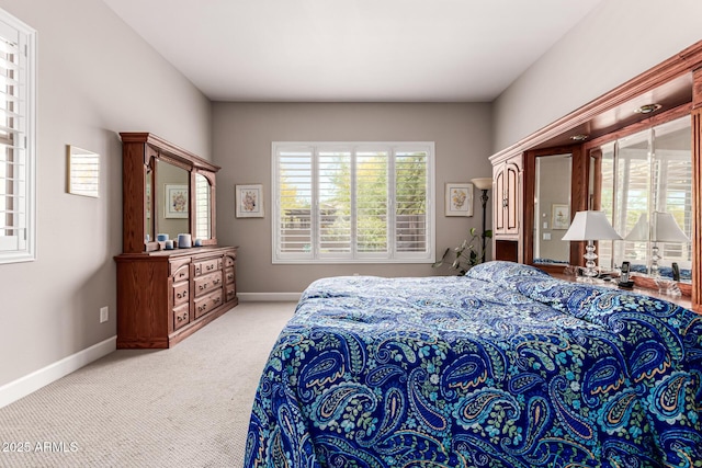 carpeted bedroom with baseboards