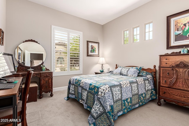 carpeted bedroom with baseboards and multiple windows