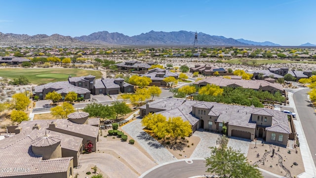 bird's eye view with a residential view, a mountain view, and view of golf course