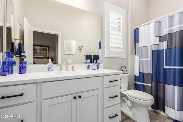 full bath with vanity, toilet, wood finished floors, and a shower with shower curtain