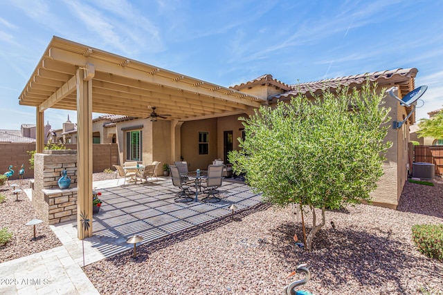 view of patio featuring a ceiling fan and fence