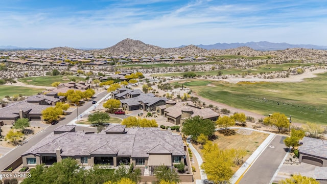 aerial view featuring a residential view, a mountain view, and golf course view