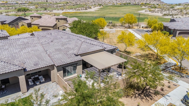 birds eye view of property with a mountain view