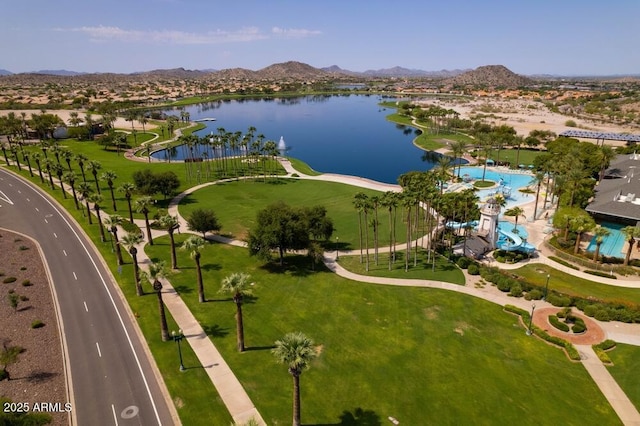 drone / aerial view featuring a residential view and a water and mountain view