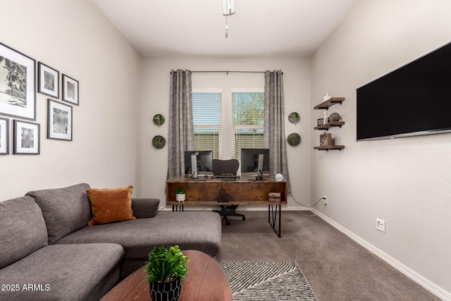 carpeted office space featuring baseboards